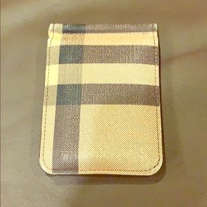 Burberry wallet with built in money clip.